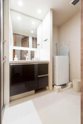 a bathroom with a sink and a mirror at HIZ HOTEL Ginza in Tokyo