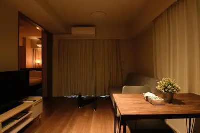 a small living room with a table and a couch at HIZ HOTEL Ginza in Tokyo