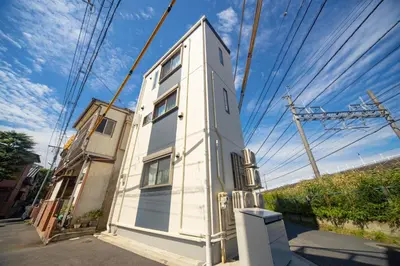 a small white building on the side of a street at Sumida-ku - House - Vacation STAY 82129 in Tokyo