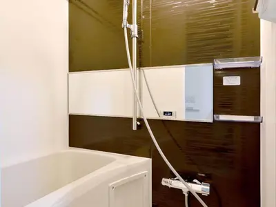 a bathroom with a bath tub and a shower at Itos Ebisu in Tokyo