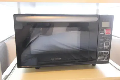 a microwave with a person inside of it at LUANA in BELUBEE in Tokyo