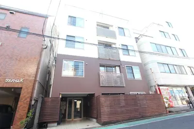 a building on a street in front of a building at LUANA in BELUBEE in Tokyo