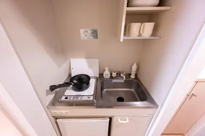 a small kitchen with a sink in a small room at LUANA in BELUBEE in Tokyo