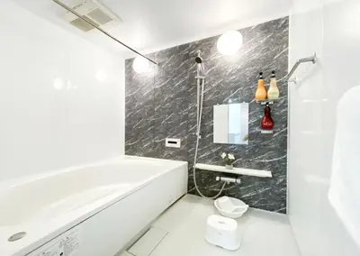 a white bathroom with a tub and a sink at Uhome Otsuka Villa in Tokyo