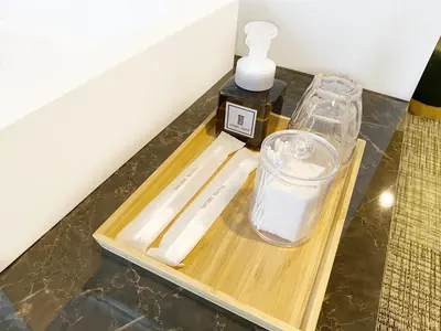 a table with a cutting board and a bottle of soap at The Barn Tokyo in Tokyo