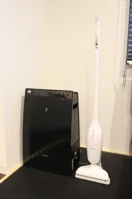 a black box with a wii remote and a white toothbrush at Hikari House in Tokyo