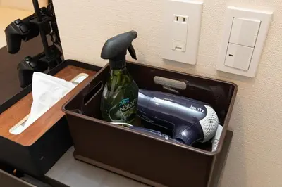 a box with a bottle and a hair dryer in it at Gennoya in Tokyo