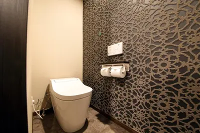 a bathroom with a toilet and a wall at s-rea TOKYO 201 in Tokyo