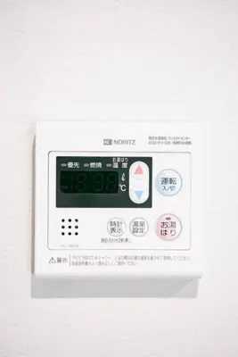 a white microwave with a label on it at s-rea TOKYO 201 in Tokyo