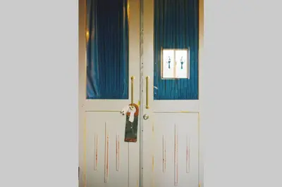 a pair of white doors in a room at Indigo flat in Asakusa in Tokyo