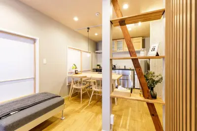 a small apartment with a loft bed and a dining room at NEGAU House in Tokyo