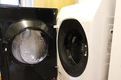 a washing machine and a dryer next to each other at HAMA HILLS Shinjuku in Tokyo
