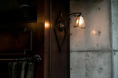 a light on a wall next to a door at Creare Ryogoku in Tokyo
