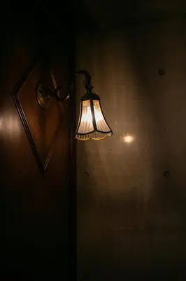 a light on a wall in a dark room at Creare Ryogoku in Tokyo