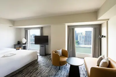 a hotel room with a bed and a large window at The Gate Hotel Ryogoku by Hulic in Tokyo
