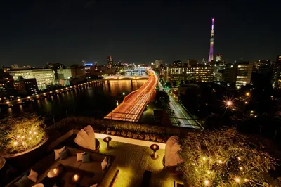 a view of a city at night with a bridge at The Gate Hotel Ryogoku by Hulic in Tokyo