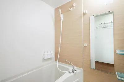 a bathroom with a sink and a mirror at Touch and Go Azumabashi - Vacation STAY 85085 in Tokyo