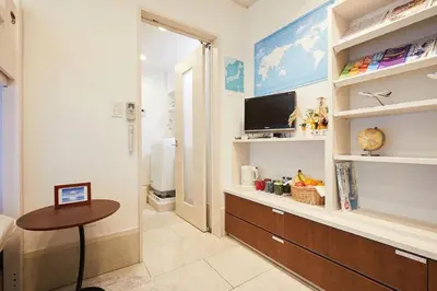 a room with a bathroom with a table and a television at Touch and Go Azumabashi - Vacation STAY 85085 in Tokyo