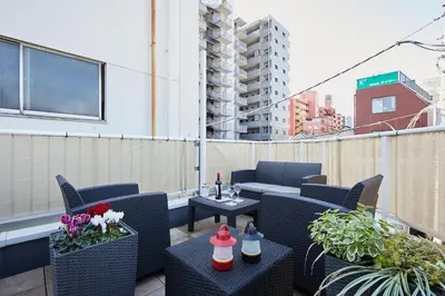 a balcony with chairs and tables on a building at Touch and Go Azumabashi - Vacation STAY 85085 in Tokyo