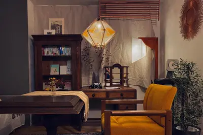 a living room with a table and a chair at TOE LIBRARY Tokyo Asakusa in Tokyo