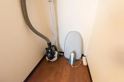 a toilet in the corner of a room at Yoshinaga heights in Tokyo
