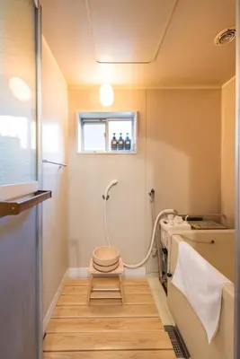 a small bathroom with a toilet and a sink at Yoshinaga heights in Tokyo