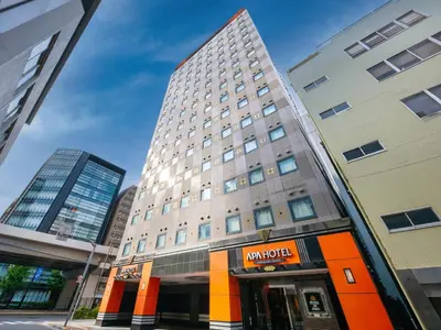 a tall building with a store in front of it at APA Hotel Akihabara Ekikita in Tokyo