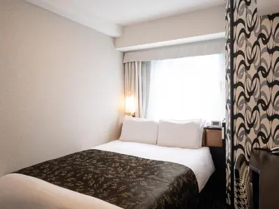 a hotel room with a bed and a window at APA Hotel Akihabara Ekikita in Tokyo