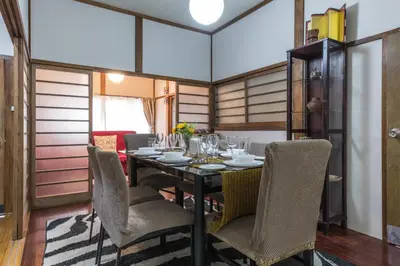 a dining room with a table and chairs at Samurai House - Large Family House, West Shinjuku in Tokyo