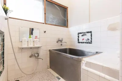 a bathroom with a sink and a shower at Samurai House - Large Family House, West Shinjuku in Tokyo