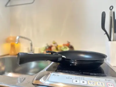 a pan sitting on top of a stove at nestay villa tokyo akihabara in Tokyo