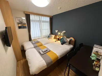 a bedroom with a large bed in a room at nestay villa tokyo akihabara in Tokyo