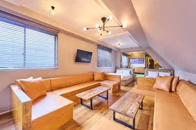 a living room with a couch and a table at Hotel Vintage Tokyo Kagurazaka in Tokyo