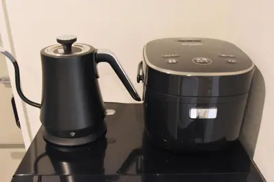 a black coffee maker sitting on top of a counter at REGALO Shibaura - Vacation STAY 87447 in Tokyo