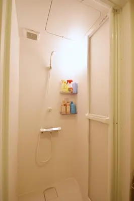 a shower in a bathroom with a shower curtain at REGALO Shibaura - Vacation STAY 87447 in Tokyo