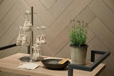 a table with a plant and bags on a wall at AC Hotel by Marriott Tokyo Ginza in Tokyo