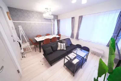a living room with a couch and a table at Kitaikebukuro Kodate - Vacation STAY 8854 in Tokyo