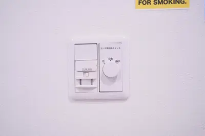 a white lightswitch on a white wall with a plug at Kitaikebukuro Kodate - Vacation STAY 8854 in Tokyo