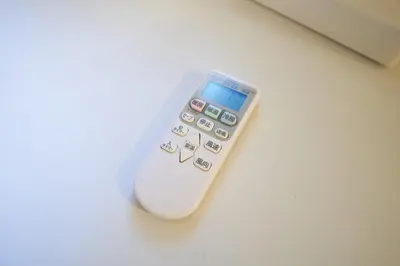 a remote control sitting on top of a table at Kitaikebukuro Kodate - Vacation STAY 8854 in Tokyo