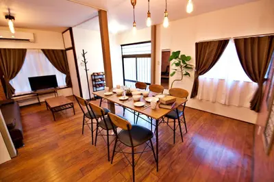 a dining room with a table and chairs at Horikiri 3-chome detached house - Vacation STAY 8849 in Tokyo