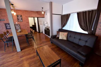 a living room with a couch and a table at Horikiri 3-chome detached house - Vacation STAY 8849 in Tokyo