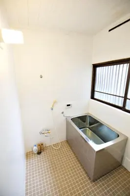 a bath tub in a bathroom with a window at Horikiri 3-chome detached house - Vacation STAY 8849 in Tokyo