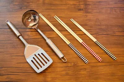 a group of utensils sitting on a wooden table at Horikiri 3-chome detached house - Vacation STAY 8849 in Tokyo