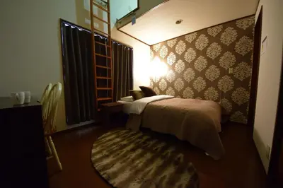 a small bedroom with a bed and a rug at Ikebukuro Kodate - Vacation STAY 8859 in Tokyo