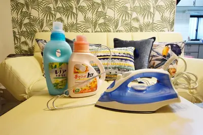 a table with two bottles of cleaner and a iron at Ikebukuro Kodate - Vacation STAY 8859 in Tokyo