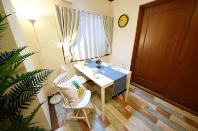 a white table and chairs in a room with a window at Ikebukuro Kodate - Vacation STAY 8859 in Tokyo
