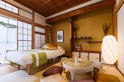 a bedroom with a bed and a table at Horikiri Kodate - Vacation STAY 8860 in Tokyo