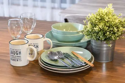 a table with plates and bowls and glasses and flowers at Horikiri Kodate - Vacation STAY 8860 in Tokyo