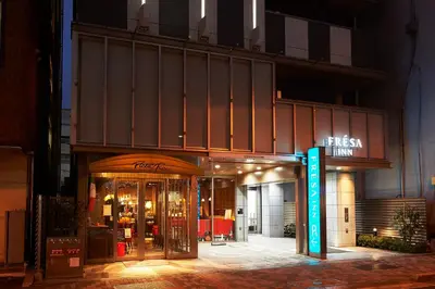 a store front with a sign in front of it at Sotetsu Fresa Inn Kanda-Otemachi in Tokyo