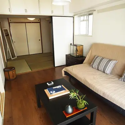 a living room with a couch and a table at Asayake in Tokyo
